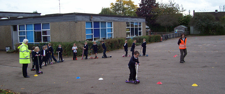 KS1 pupils using the scooters